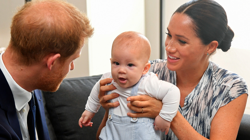 Prince Harry and Meghan Markle playing with baby Archie