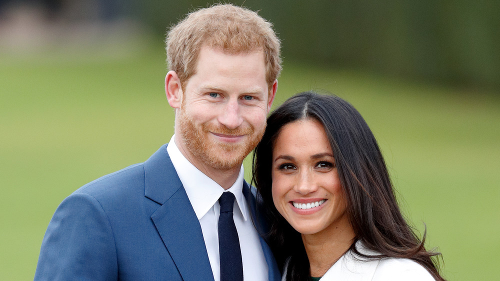 Prince Harry and Meghan Markle smiling