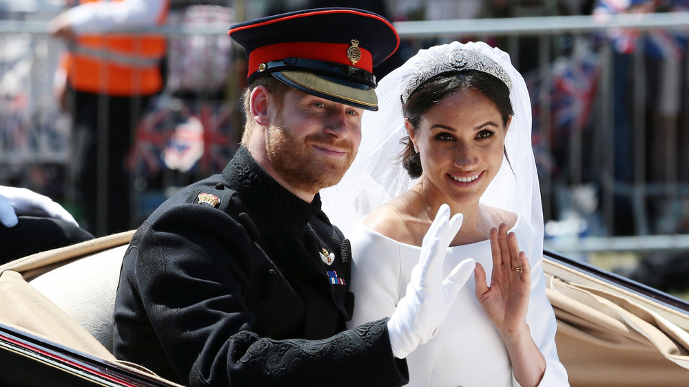 Prince Harry and Meghan Markle waving after wedding