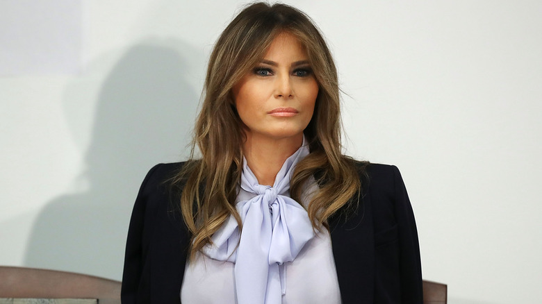 Melania Trump with a lavender scarf