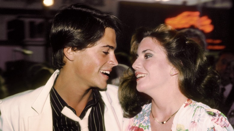 Rob Lowe staring at Melissa Gilbert grinning