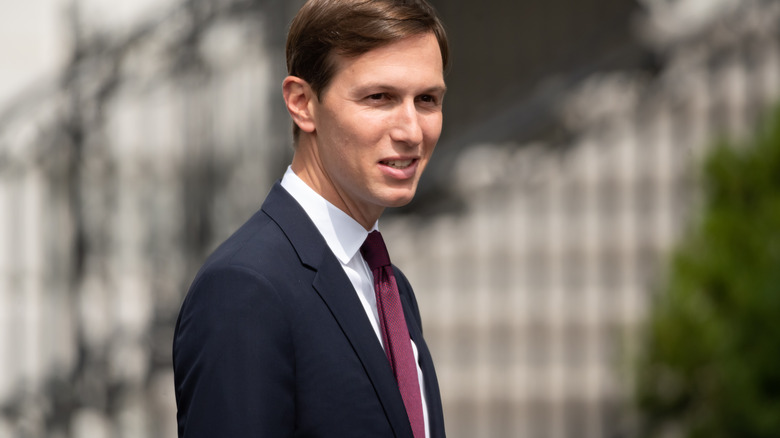 Jared Kushner, walking with slight smile