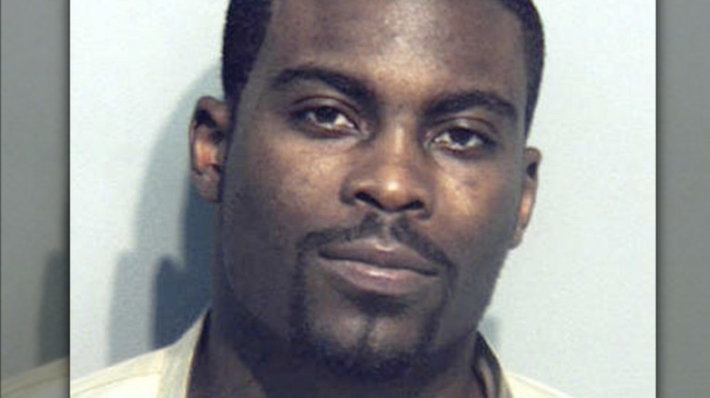 Michael Vick smiling goatee mug shot