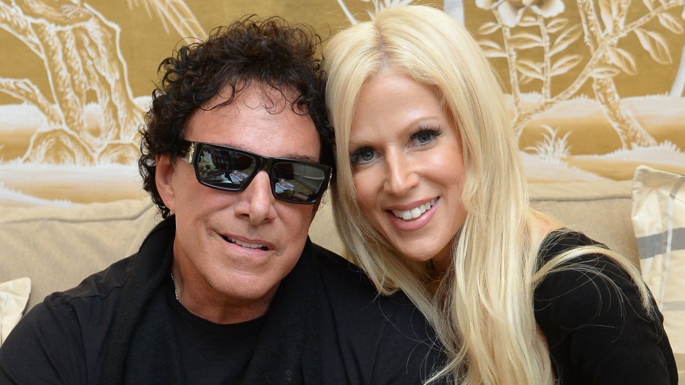 Neal Schon and Michaele Salahi (Schon) smiling with their heads resting against each other