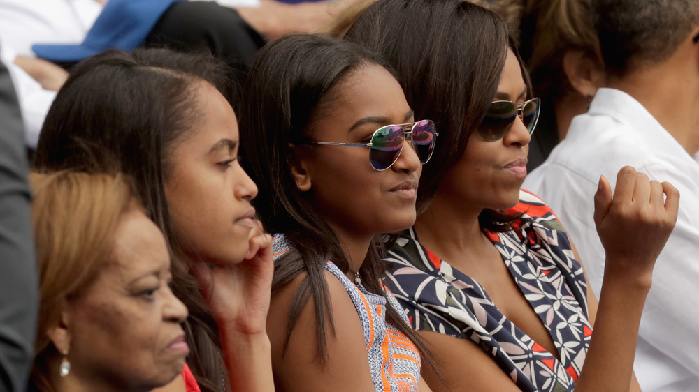 Michelle, Sasha, and Malia Obama at a Tampa baseball game