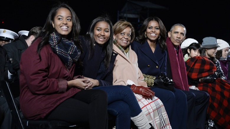 The four Obamas and Marian Robinson sit together