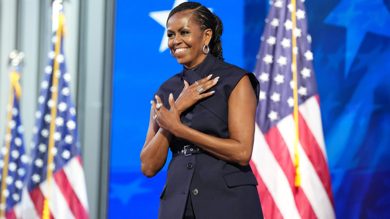 Michelle Obama smiling on stage