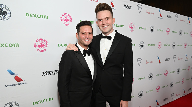 Josh Flagg, Andrew Beyer posing on red carpet