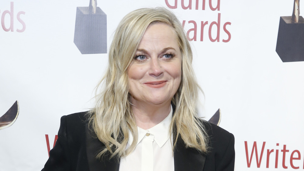 Amy Poehler in a black tuxedo