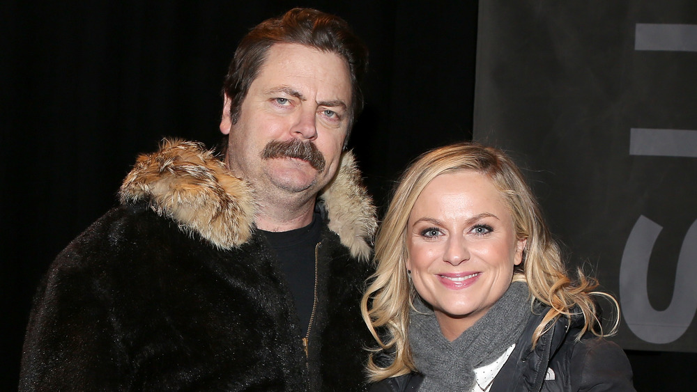 Nick Offerman and Amy Poehler bundled up