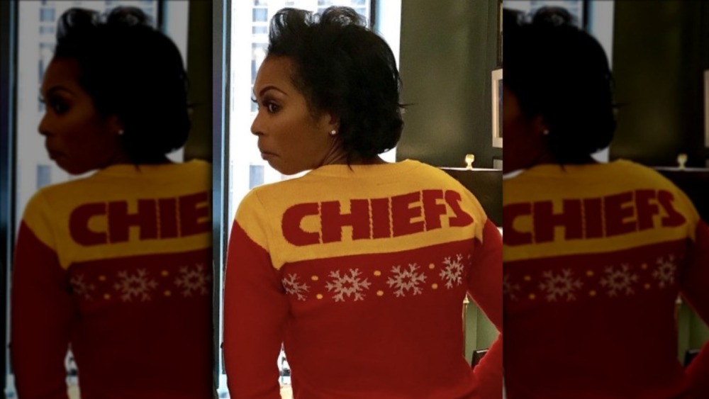 Harris Faulkner posing with Kansas City Chiefs sweater