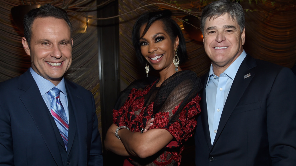 Brian Kilmeade, Harris Faulkner, and Sean Hannity posing for a picture