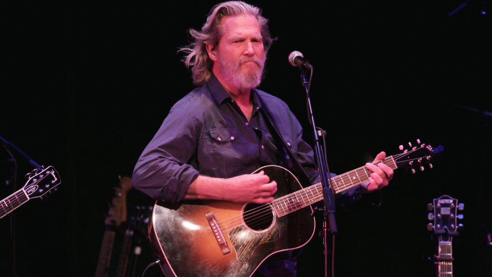 Jeff Bridges on stage with guitar