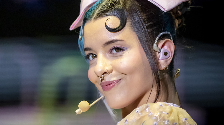 Melanie Martinez smirking 