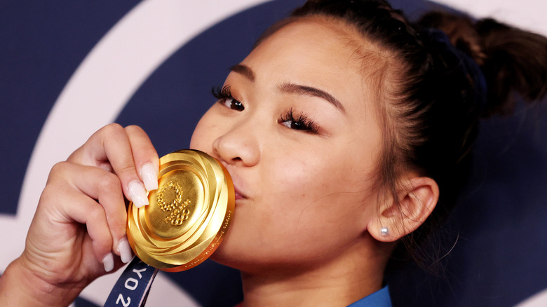 Sunisa Lee kissing her medal