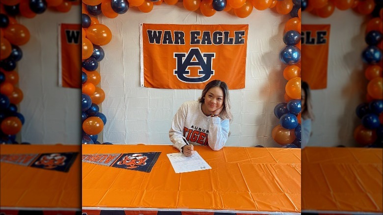 Sunisa Lee signing college papers