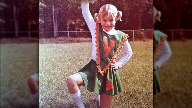 Young Pauley Perrette in cheer outfit 