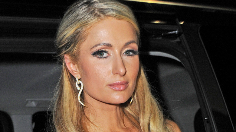 Paris Hilton with long white earring