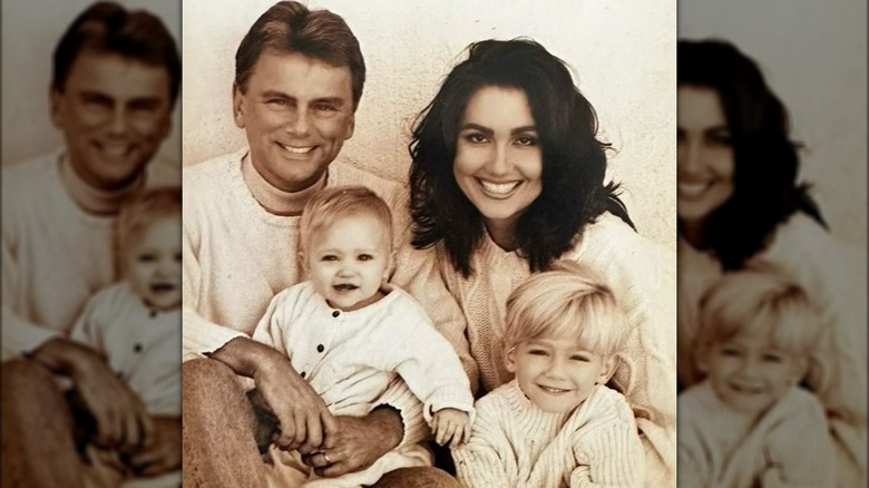 Pat Sajak and Lesly Brown holding their children