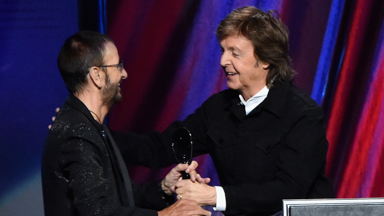 Ringo Starr and Paul McCartney together hugging