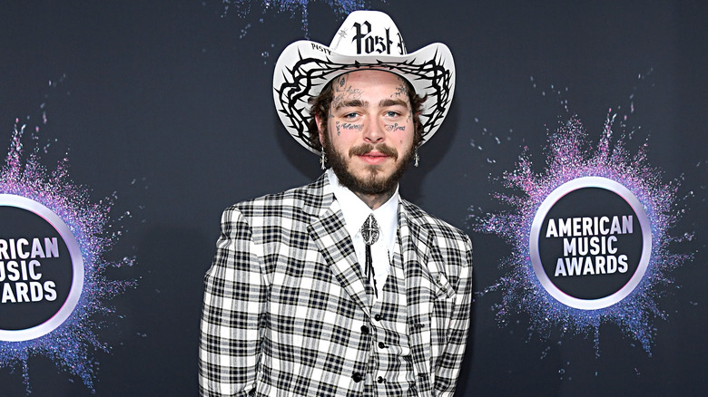 Post Malone wearing a checkered suit