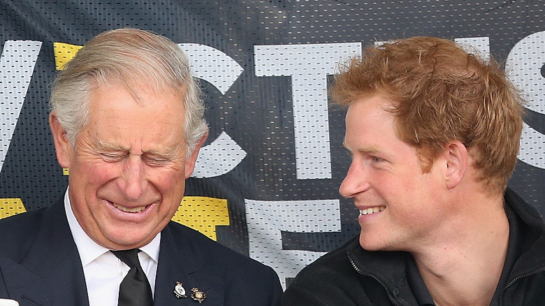 Prince Harry and King Charles smile
