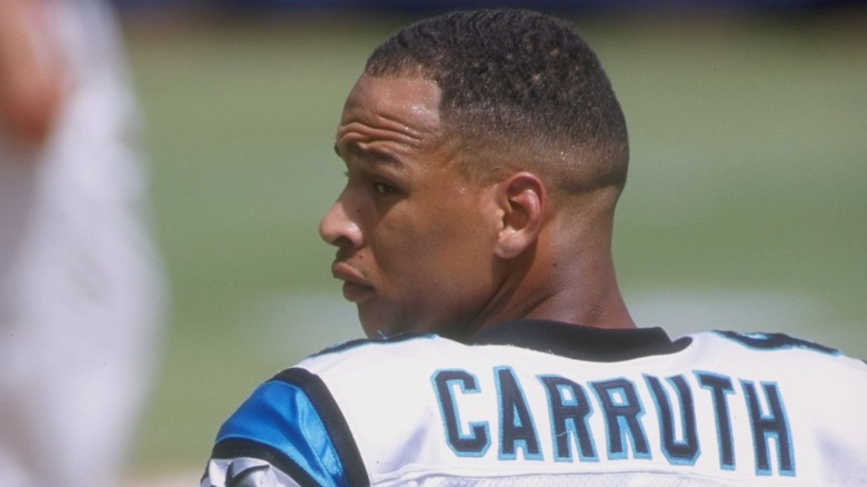 Rae Carruth looking over shoulder