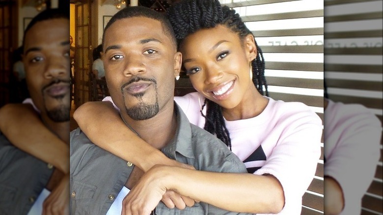 Ray J and Brandy Norwood embracing