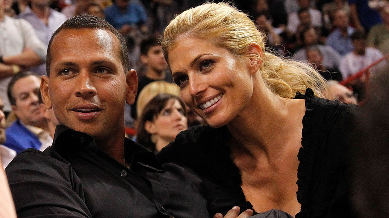 Alex Rodriguez and Torrie Wilson at an NBA game