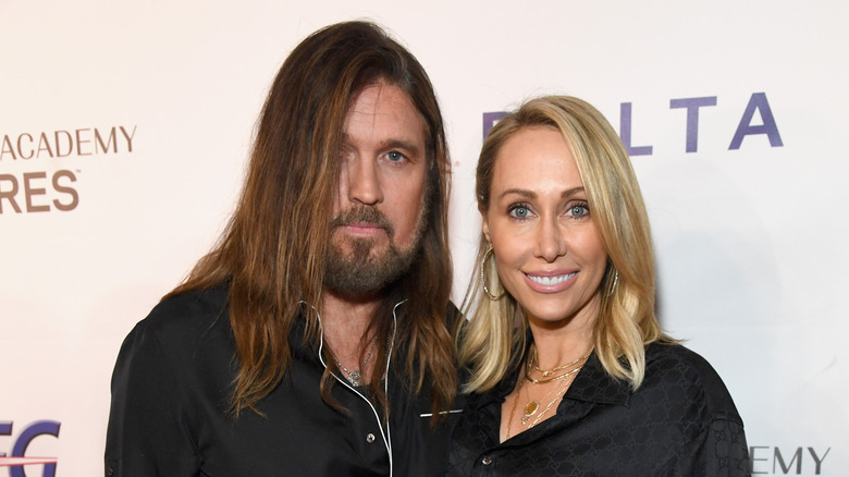 Tish and Billy Ray Cyrus smiling