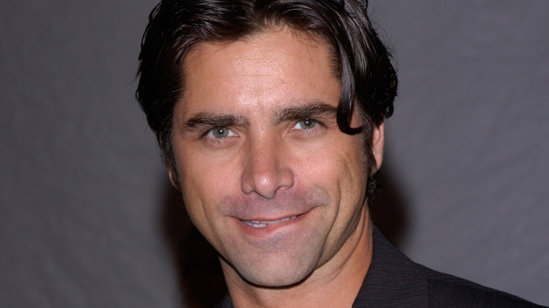 John Stamos biting lip