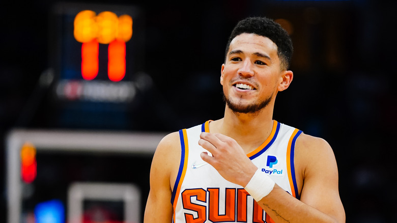 Devin Booker smiling during a basketball game