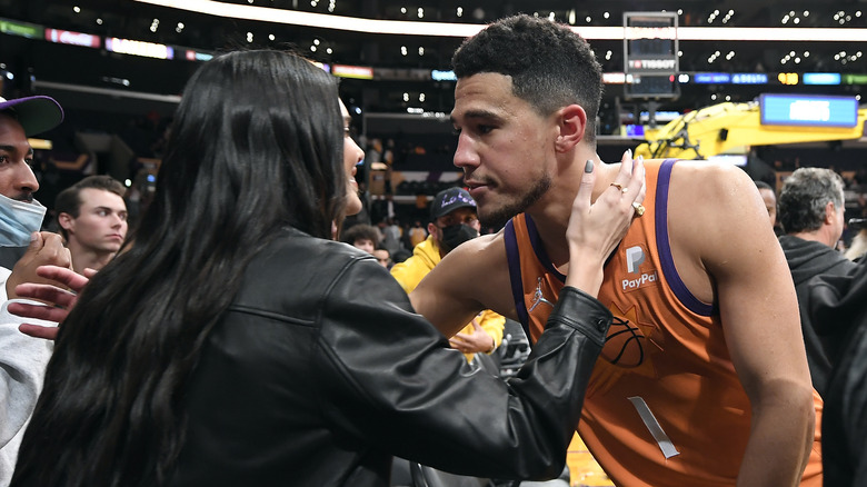 Kendall Jenner and Devin Booker kissing and hugging after game