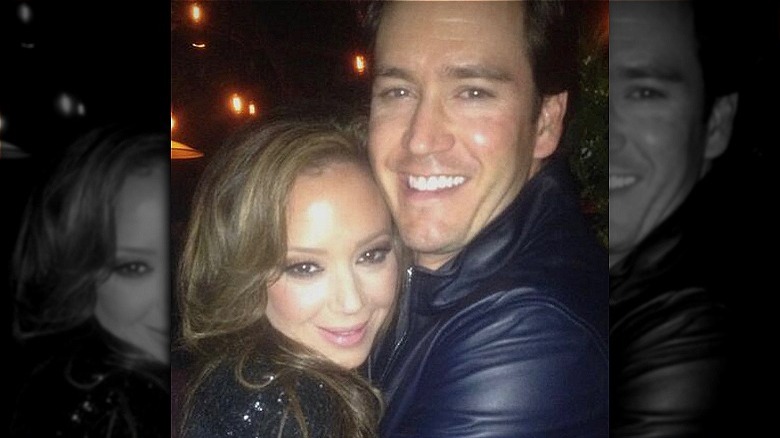 Leah Remini and Mark Paul Gosselaar hugging