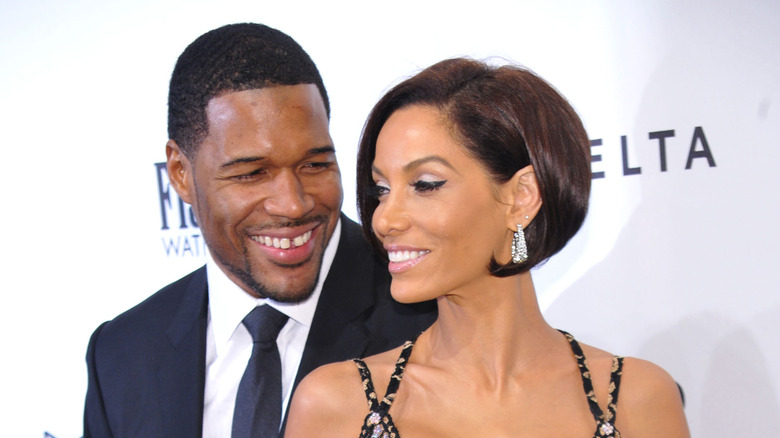 Michael Strahan and Nicole Murphy smiling