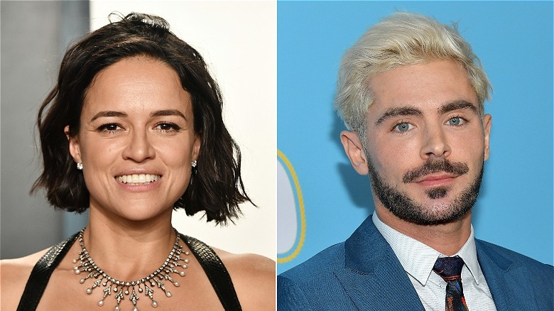 Michelle Rodriguez smiling; Zac Efron sporting beard