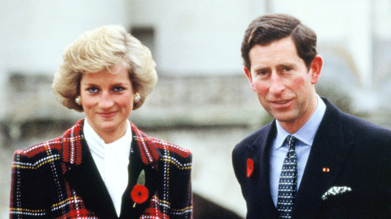 Princess Diana and Prince Charles standing outside together