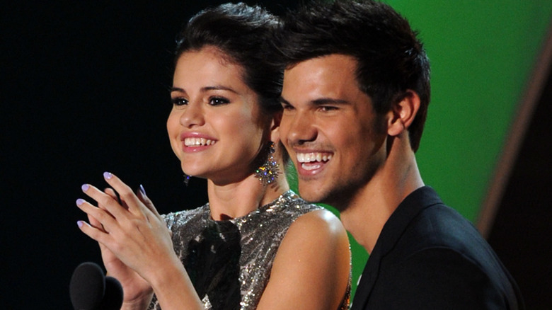 Selena Gomez and Taylor Lautner smiling in 2011