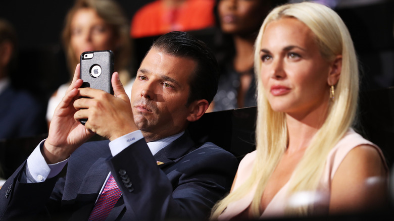 Donald Trump Jr taking a photo next to Vanessa Trump