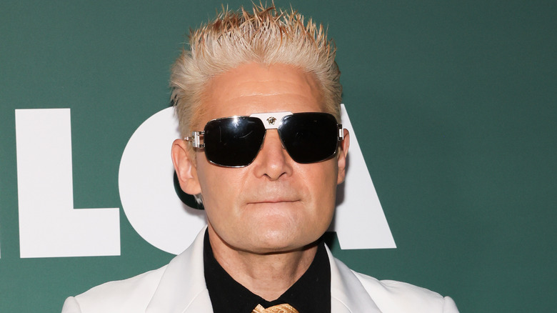 Corey Feldman with blond hair and sunglasses