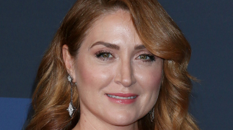 Sasha Alexander smiles at an event