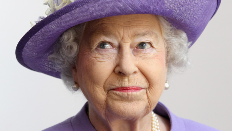Queen Elizabeth II in a purple hat
