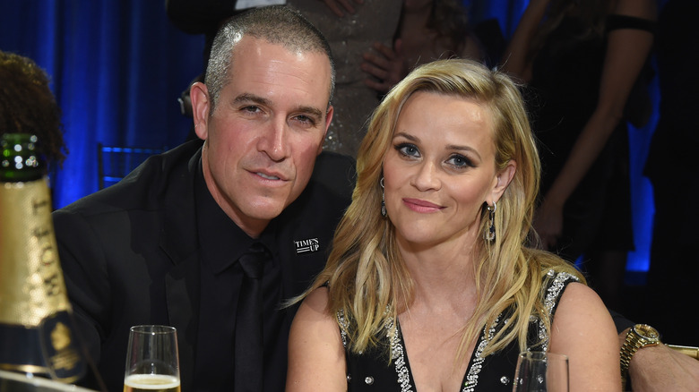 Jim Toth sitting with Reese Witherspoon