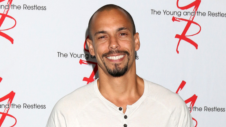Bryton James smiling on the Young and the Restless red carpet
