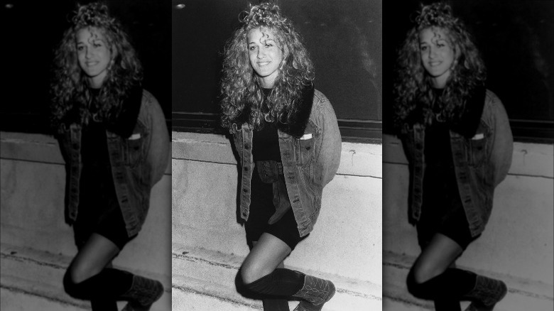 Sarah Jessica Parker posing in denim jacket in 1987