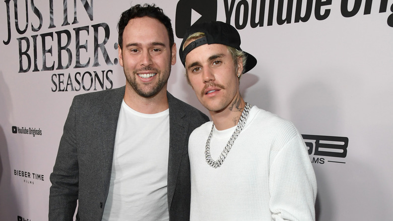 Scooter Braun posing with Justin Bieber
