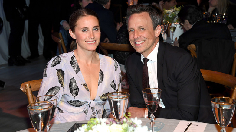 Alexi Ashe and Seth Meyers both smiling