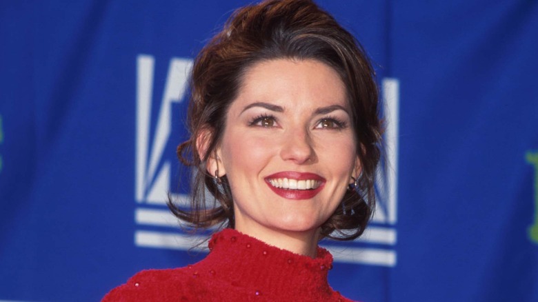 Shania Twain smiles at an event