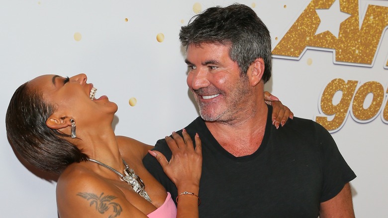 Simon Cowell and Mel B smile 