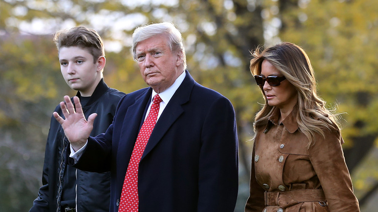 Barron, Donald, and Melania Trump walking